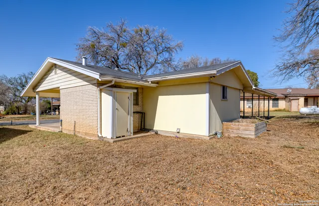 a view of a house with a snow in the yard