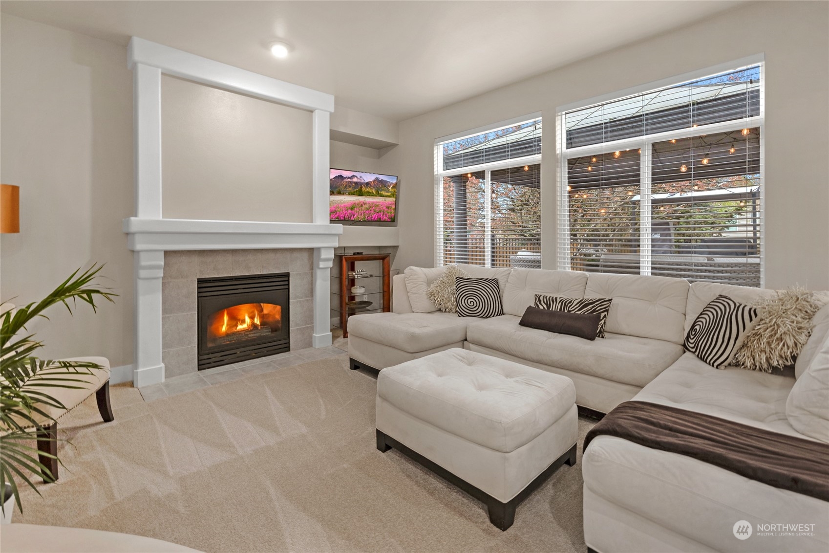 18712 33rd Avenue Southeast Bothell, WA 98012 - Photo 13 of 39 a living room with furniture and a fireplace
