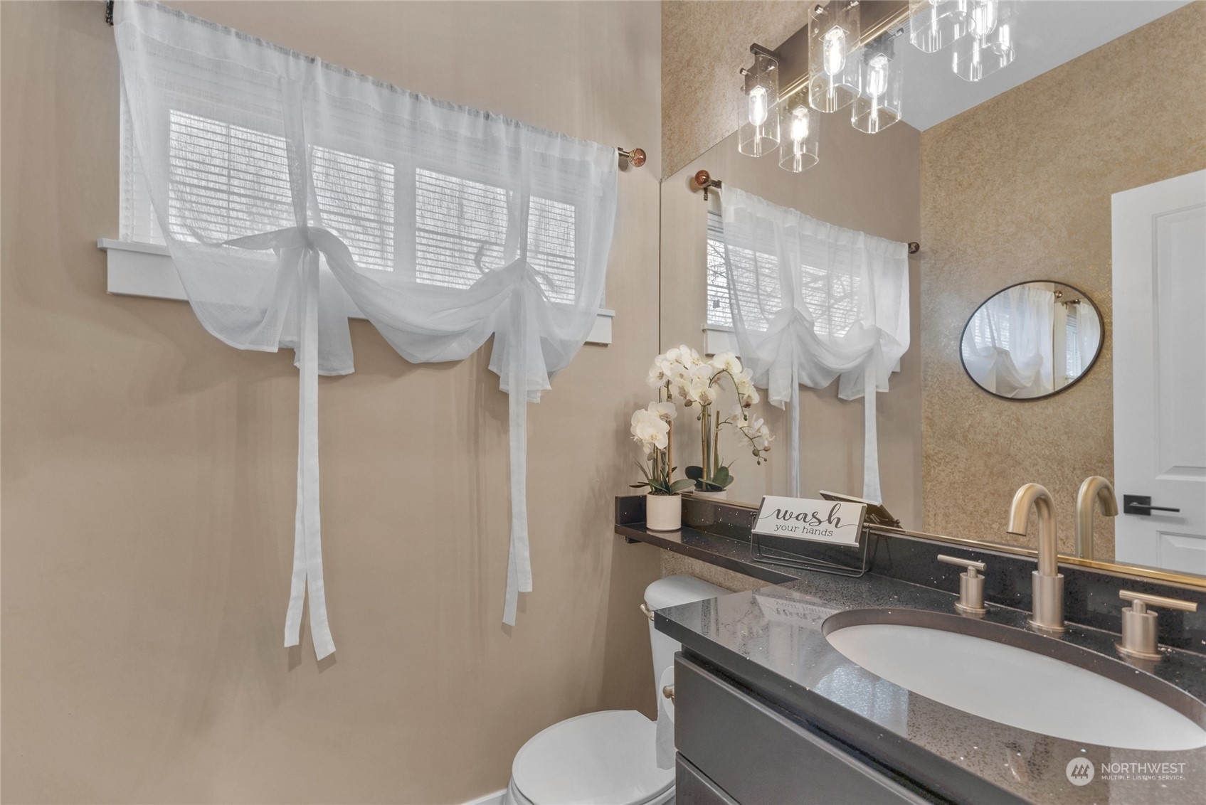 18712 33rd Avenue Southeast Bothell, WA 98012 - Photo 20 of 39 a bathroom with a granite countertop double vanity sink and a mirror