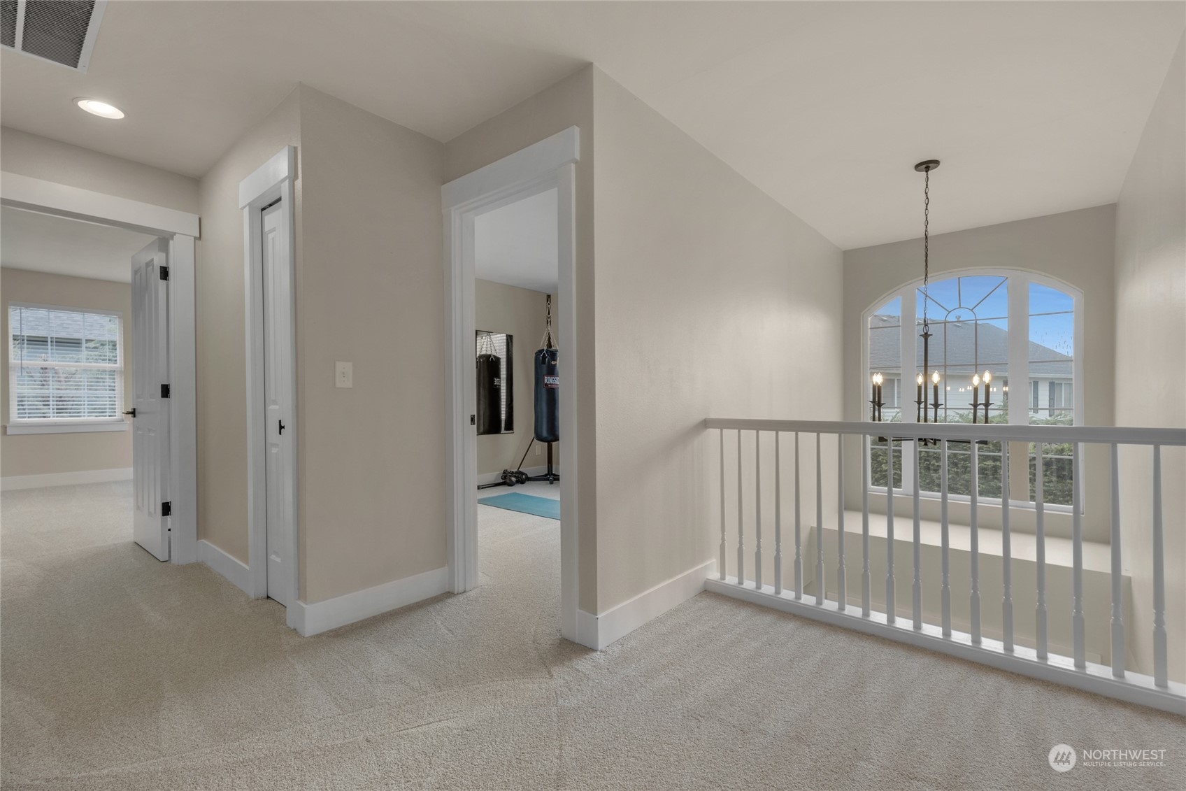 18712 33rd Avenue Southeast Bothell, WA 98012 - Photo 28 of 39 a view of a hallway with a chandelier