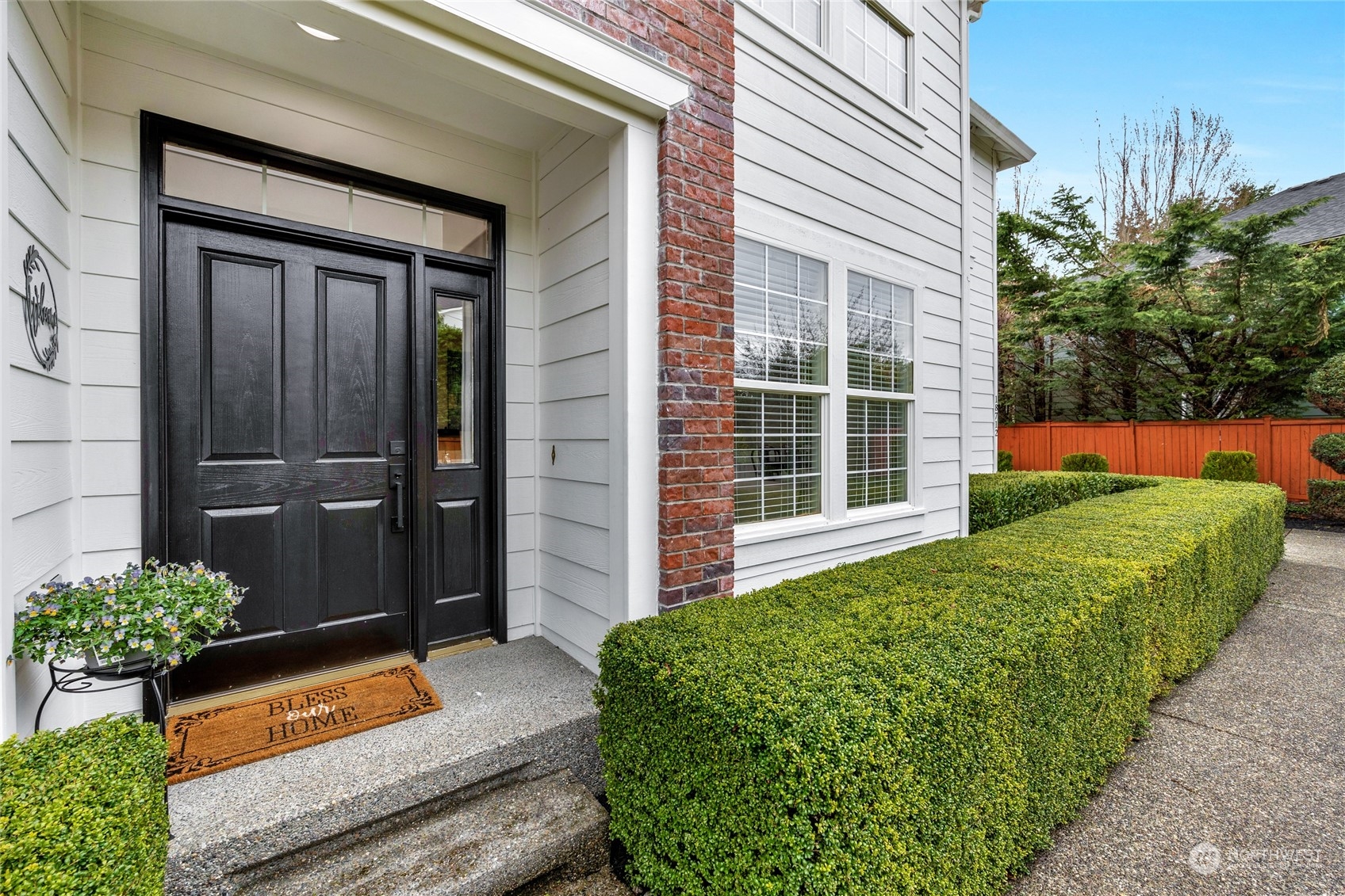 18712 33rd Avenue Southeast Bothell, WA 98012 - Photo 4 of 39 a front view of a house with a yard