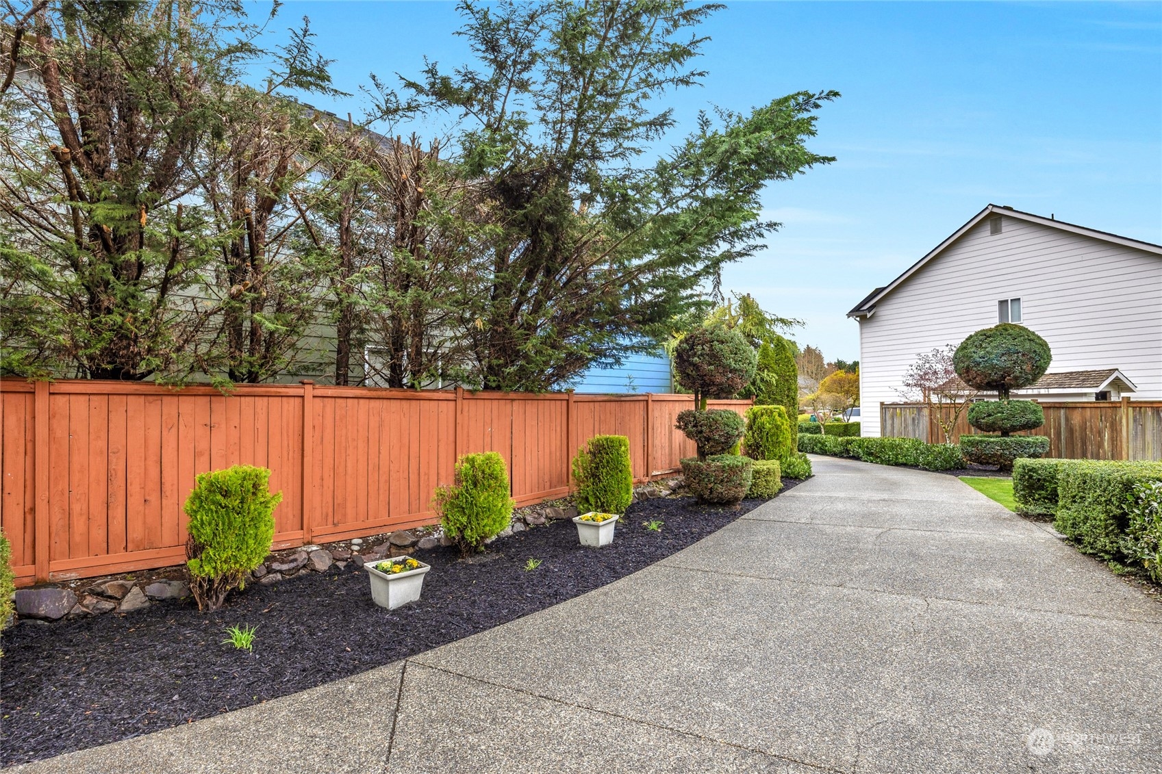 18712 33rd Avenue Southeast Bothell, WA 98012 - Photo 6 of 39 a front view of a house with garden