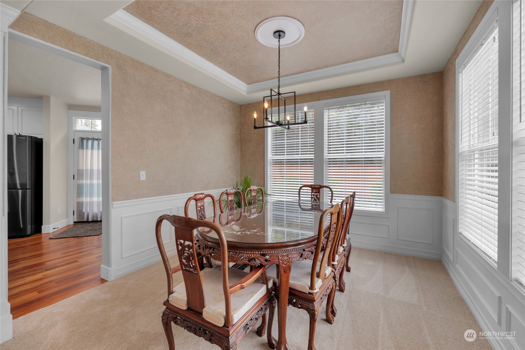 18712 33rd Avenue Southeast Bothell, WA 98012 - Photo 9 of 39 a dining room with furniture a chandelier and wooden floor