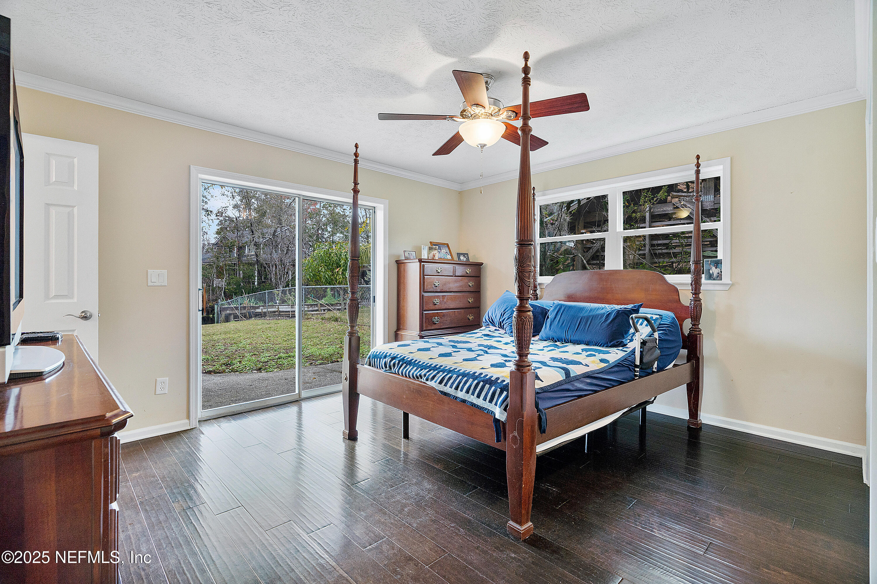 12932 Helm Drive Jacksonville, FL 32258 - Photo 11 of 42 a bedroom with furniture and large window