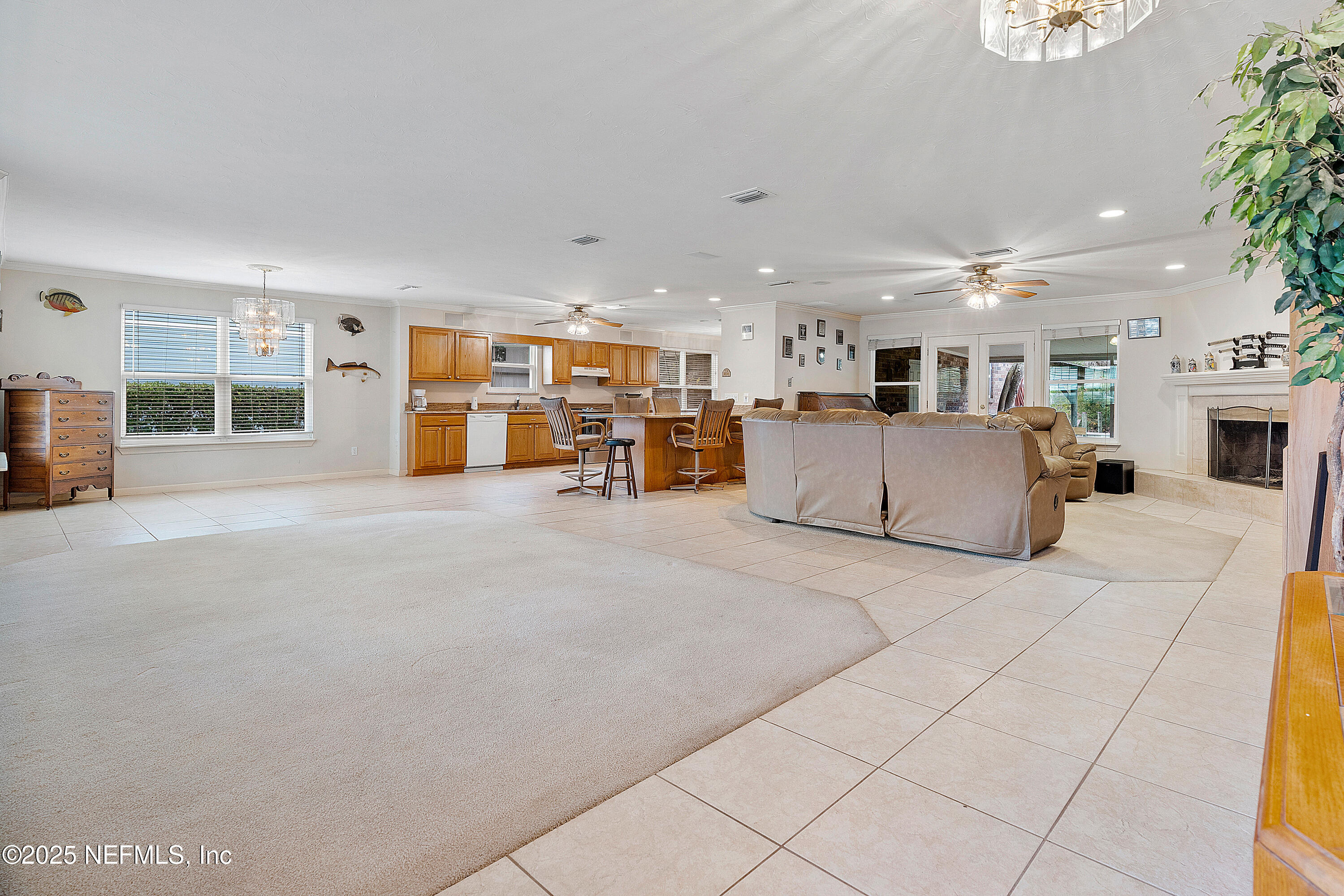 12932 Helm Drive Jacksonville, FL 32258 - Photo 14 of 42 a living room with furniture and a flat screen tv