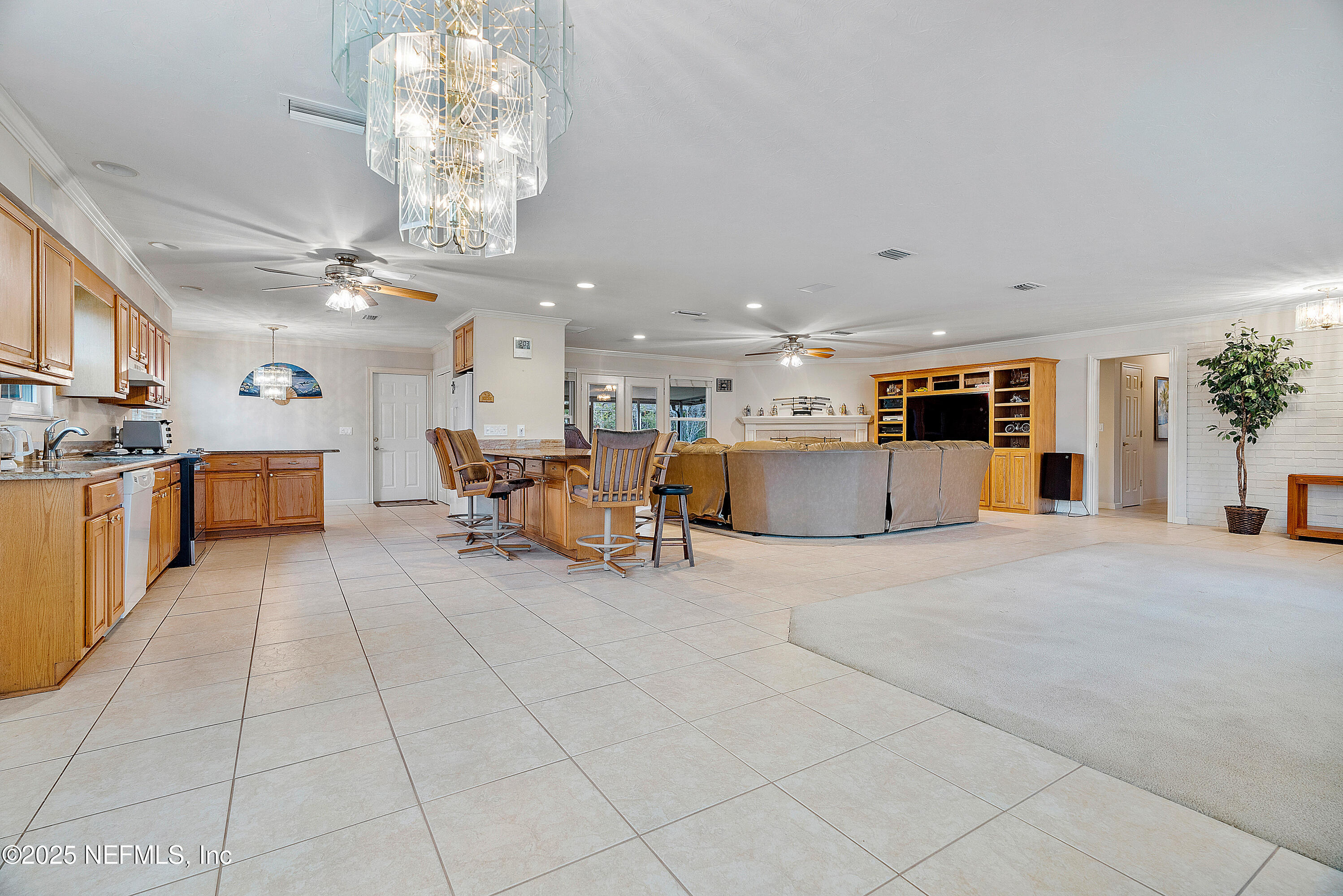 12932 Helm Drive Jacksonville, FL 32258 - Photo 17 of 42 a large white kitchen with lots of counter space and furniture