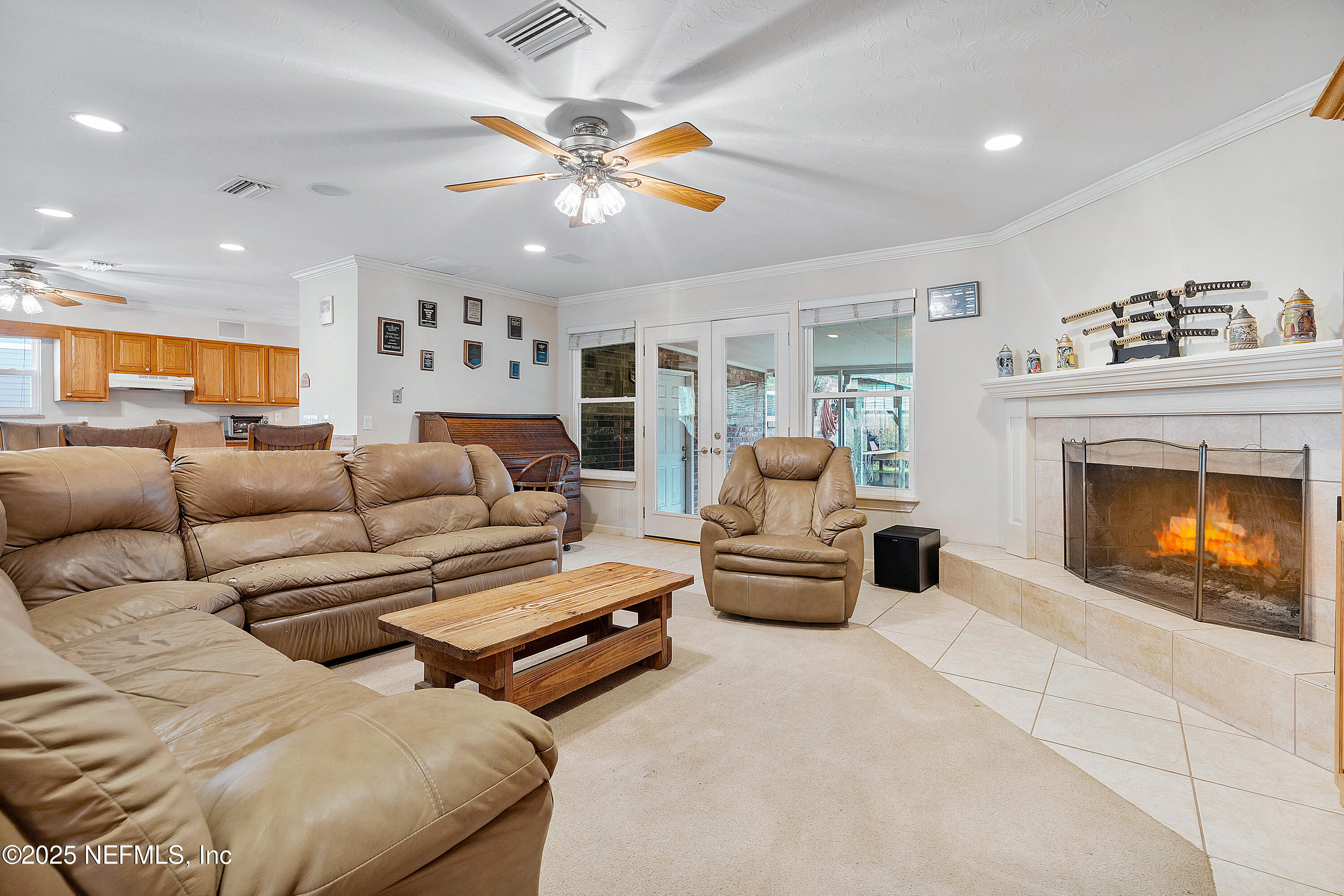 12932 Helm Drive Jacksonville, FL 32258 - Photo 21 of 42 a living room with furniture and a fireplace