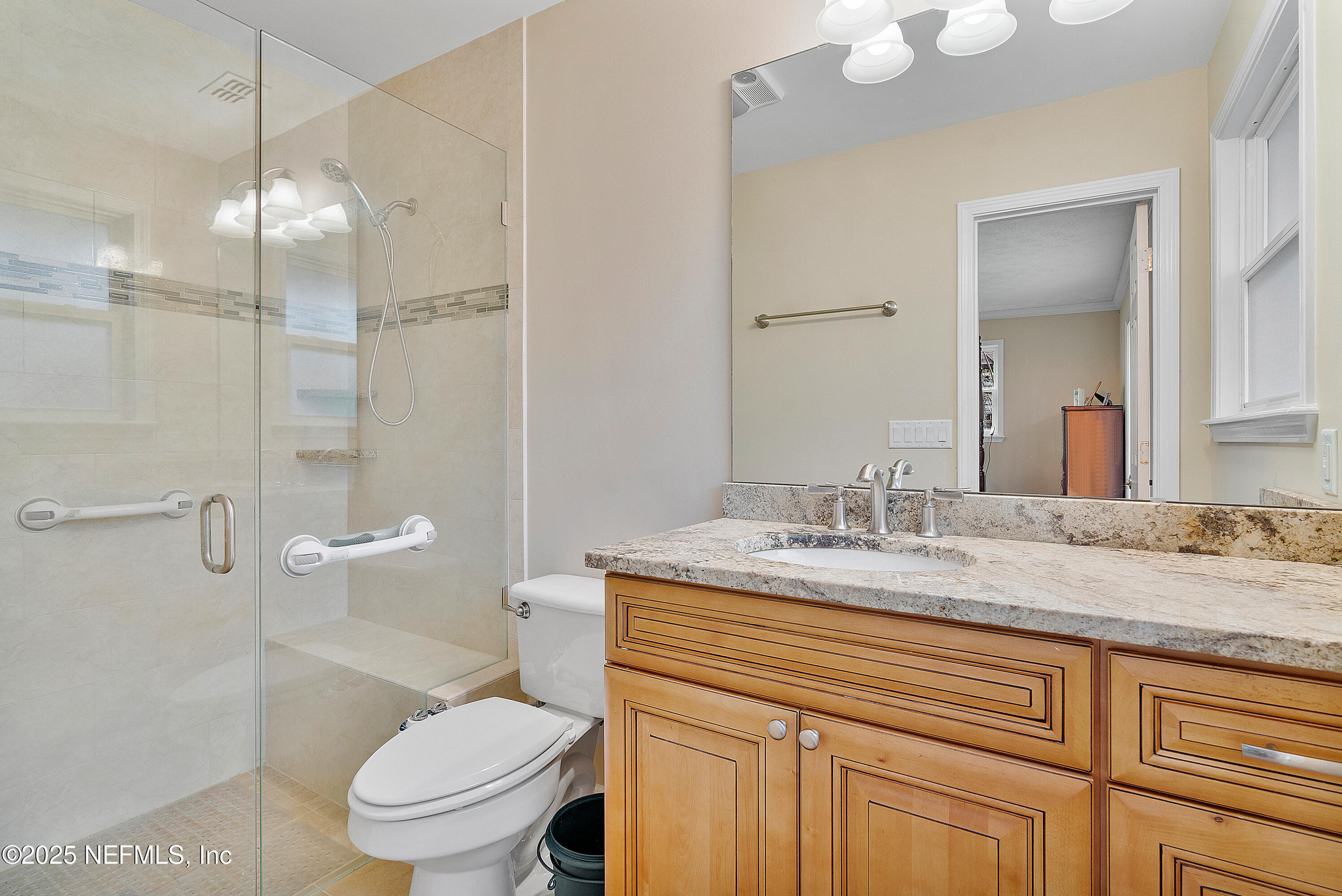 12932 Helm Drive Jacksonville, FL 32258 - Photo 25 of 42 a bathroom with a granite countertop sink toilet and shower