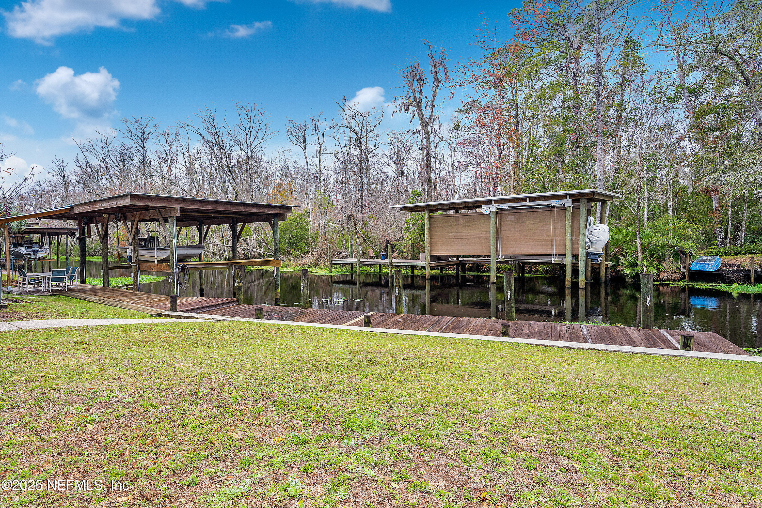 12932 Helm Drive Jacksonville, FL 32258 - Photo 26 of 42 a view of a swimming pool with a patio