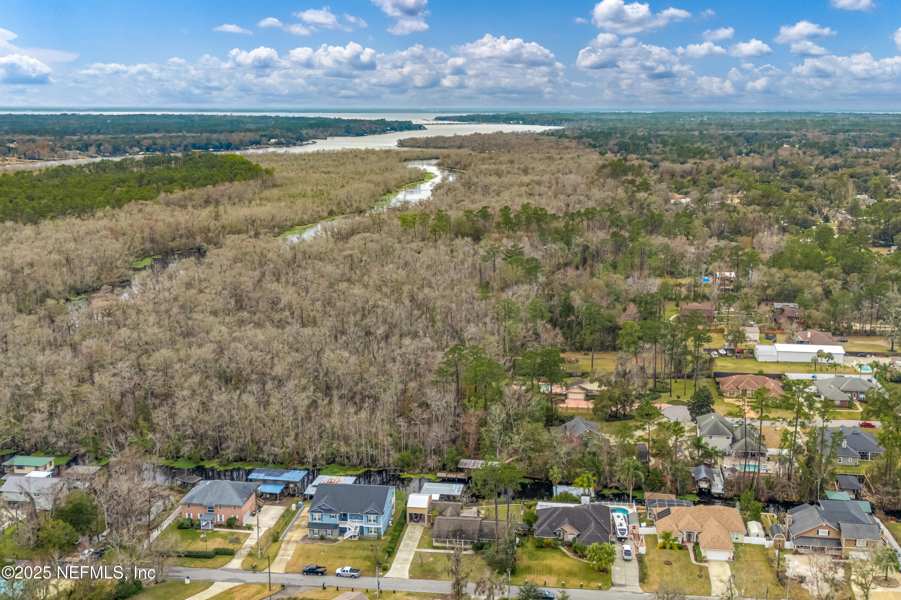 12932 Helm Drive Jacksonville, FL 32258 - Photo 34 of 42 a view of a lake in middle of the town