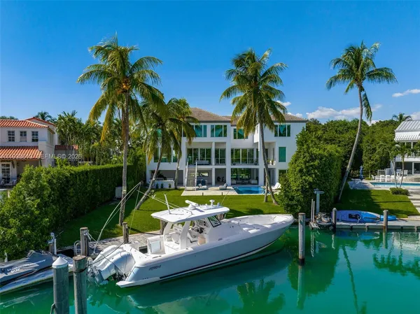 an aerial view of a house with a garden lake view