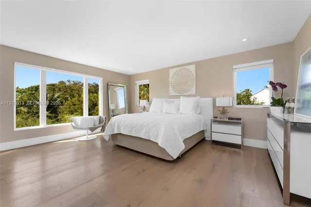 a bedroom with furniture and a window