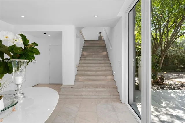 a view of a dining room with furniture window and outside view