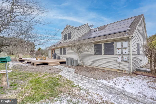 a view of a patio with a table and chairs