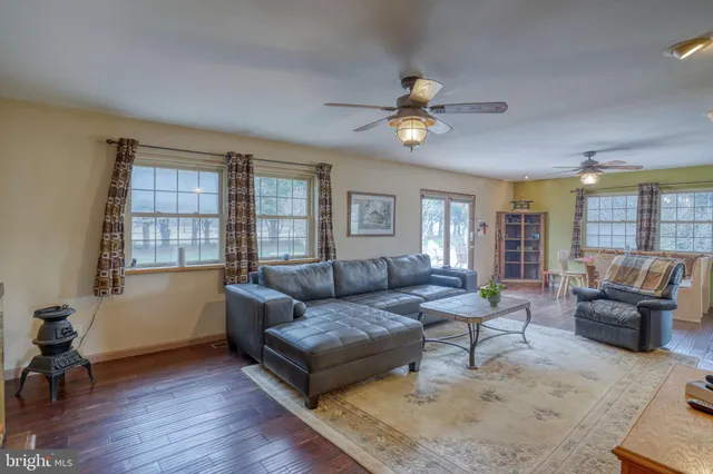 a view of a dining room with furniture and a wooden floor