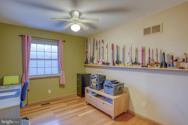 a view of room with a ceiling fan and a rug