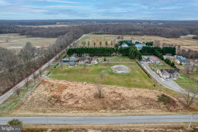 a view of a swimming pool with a yard