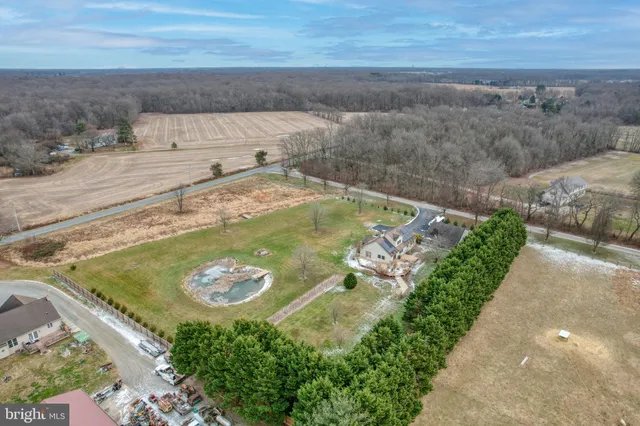 a view of a swimming pool with a yard