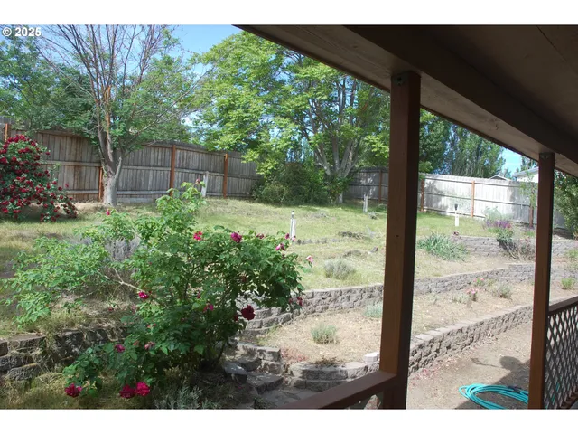a backyard of a house with lots of green space