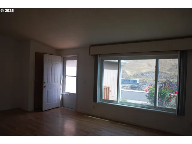 a kitchen with a refrigerator and a sink