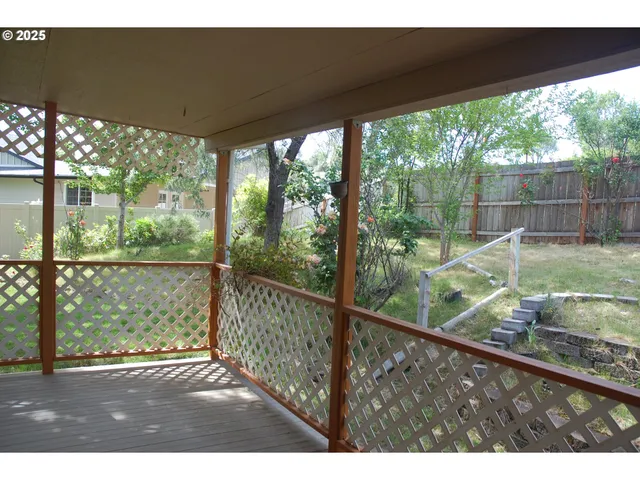 a view of a deck with a yard