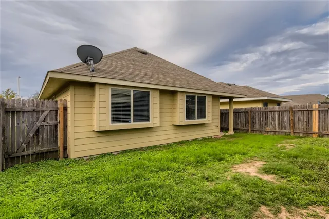a front view of house with yard and outdoor seating