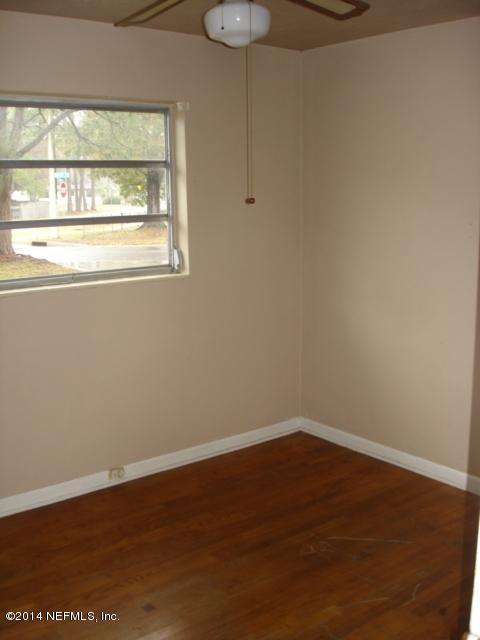 2425 Dean Road Jacksonville, FL 32216 - Photo 8 of 11 a view of a small space with wooden floor and a window