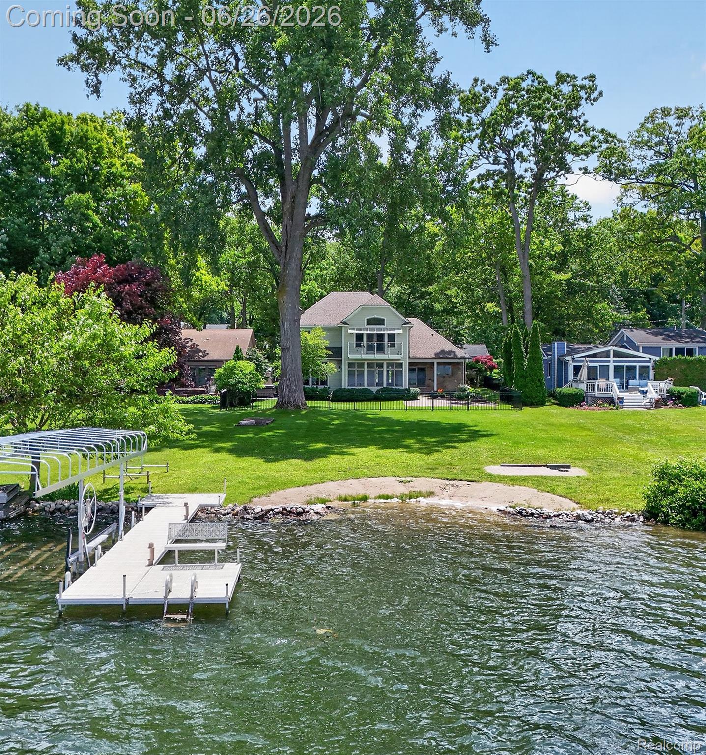 Waterfront property featuring a private dock with an attached lift
