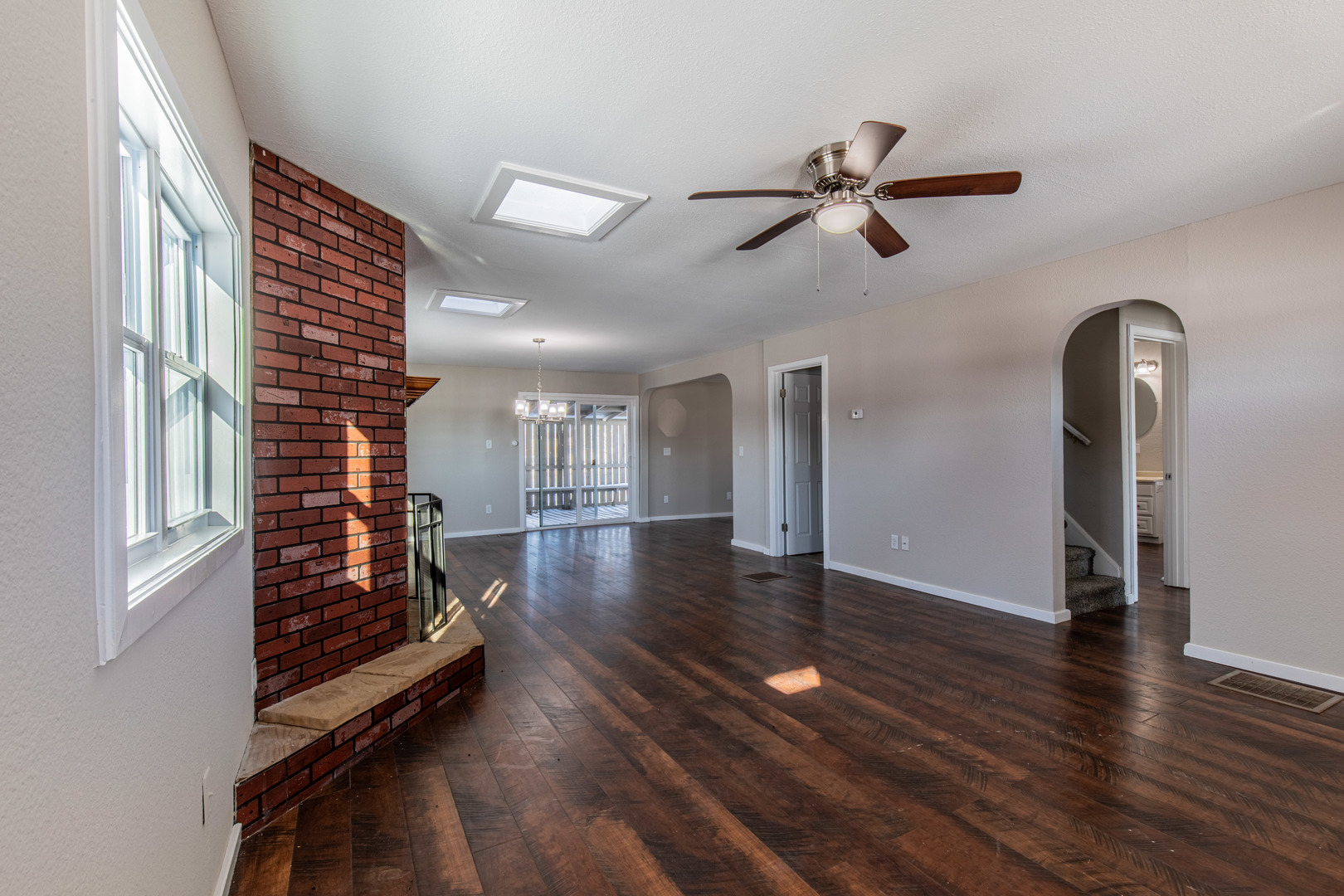 522 East 5th Street Kewanee, IL 61443 - Photo 3 of 21 a view of a hallway with wooden floor and stairs