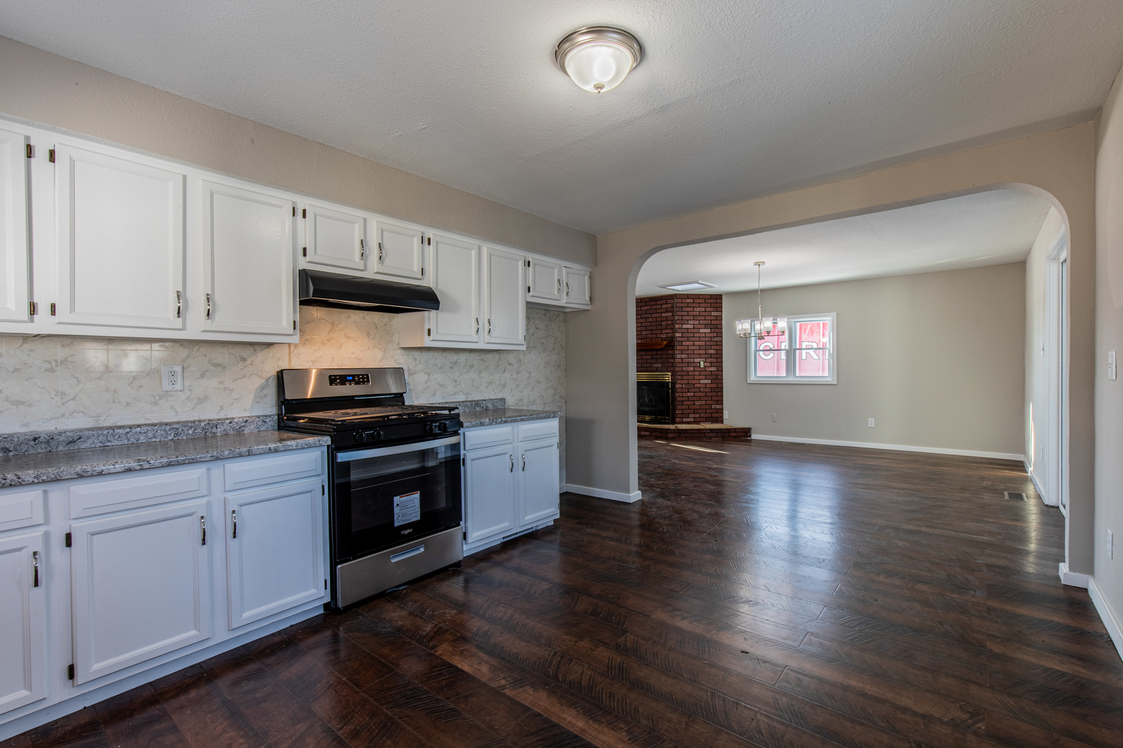 522 East 5th Street Kewanee, IL 61443 - Photo 8 of 21 a kitchen with granite countertop a stove and a wooden floors