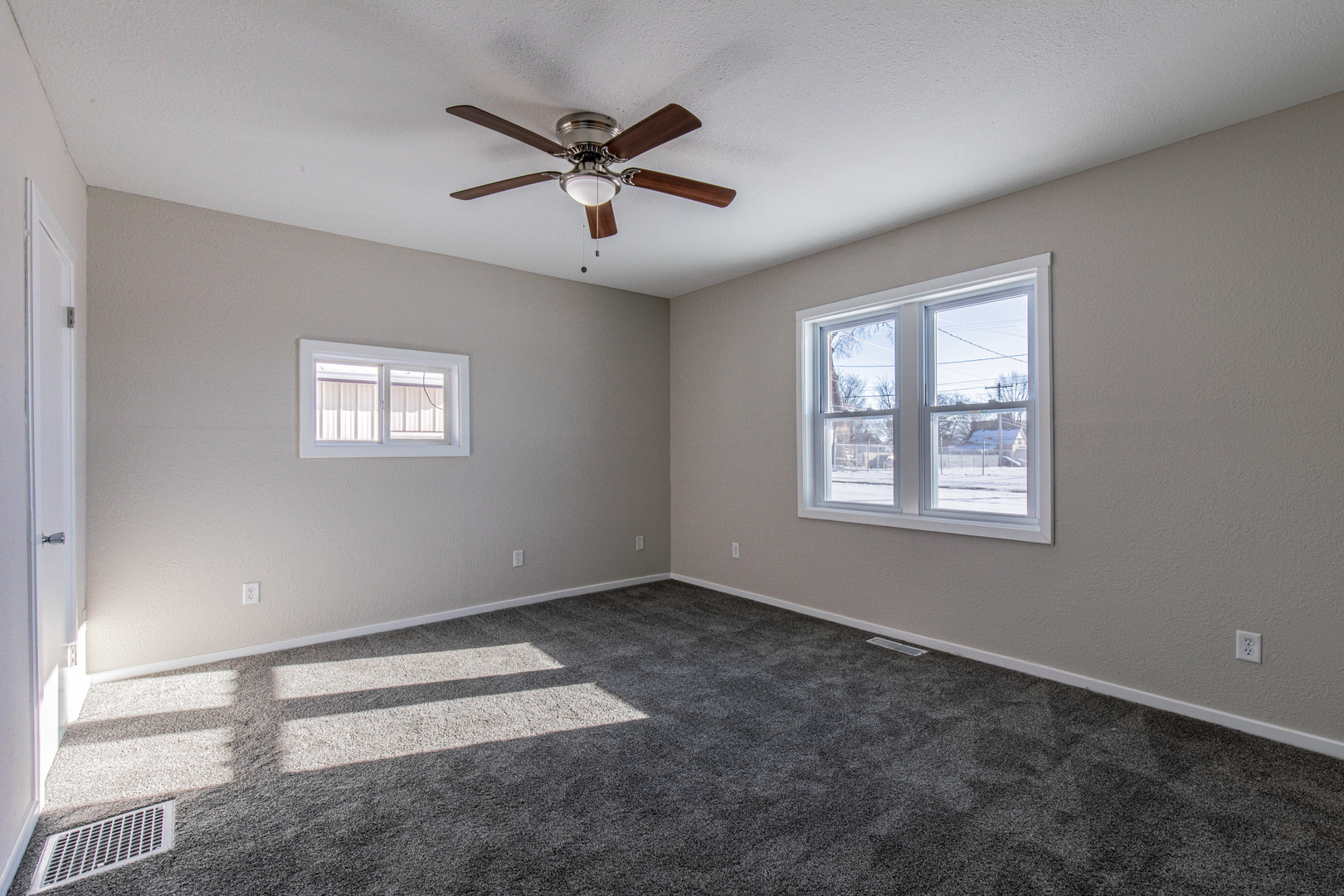 522 East 5th Street Kewanee, IL 61443 - Photo 9 of 21 a view of a big room with wooden floor and windows