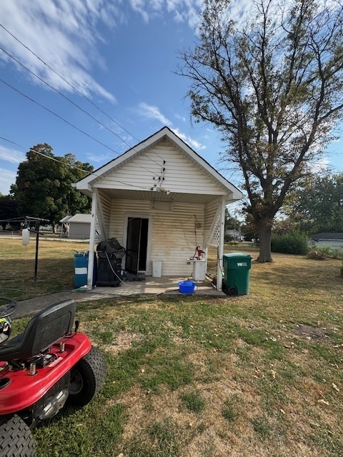 401 Adams Street Humboldt, IL 61931 - Photo 5 of 18 a front view of a house with patio