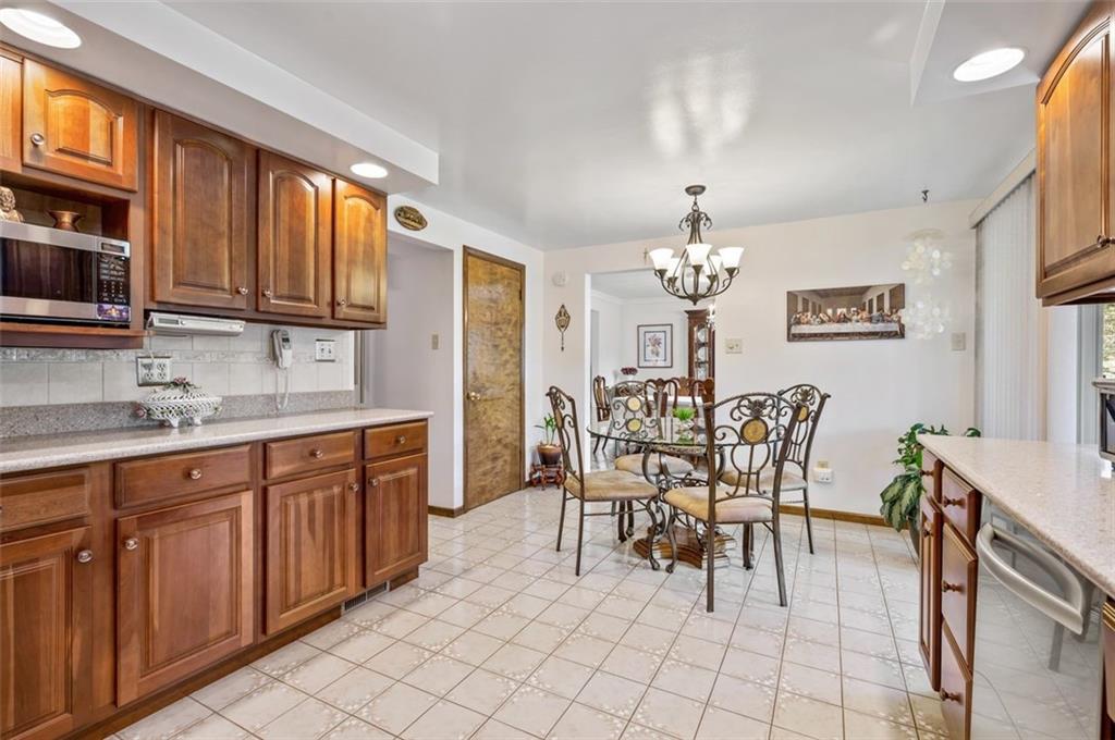 236 Philander Street Pittsburgh, PA 15218 - Photo 14 of 35 a view of a dining room with furniture and chandelier