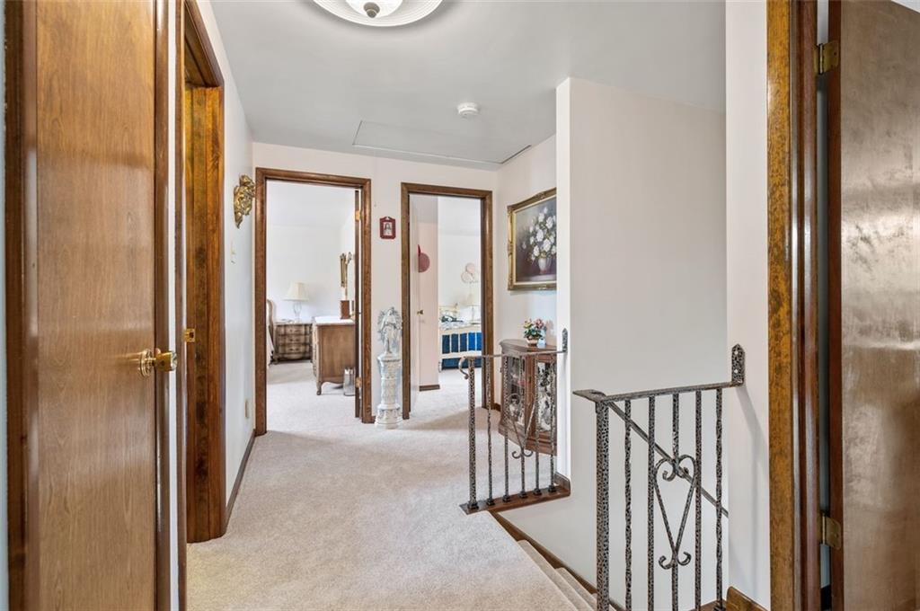 236 Philander Street Pittsburgh, PA 15218 - Photo 20 of 35 a view of a hallway with wooden floor and windows