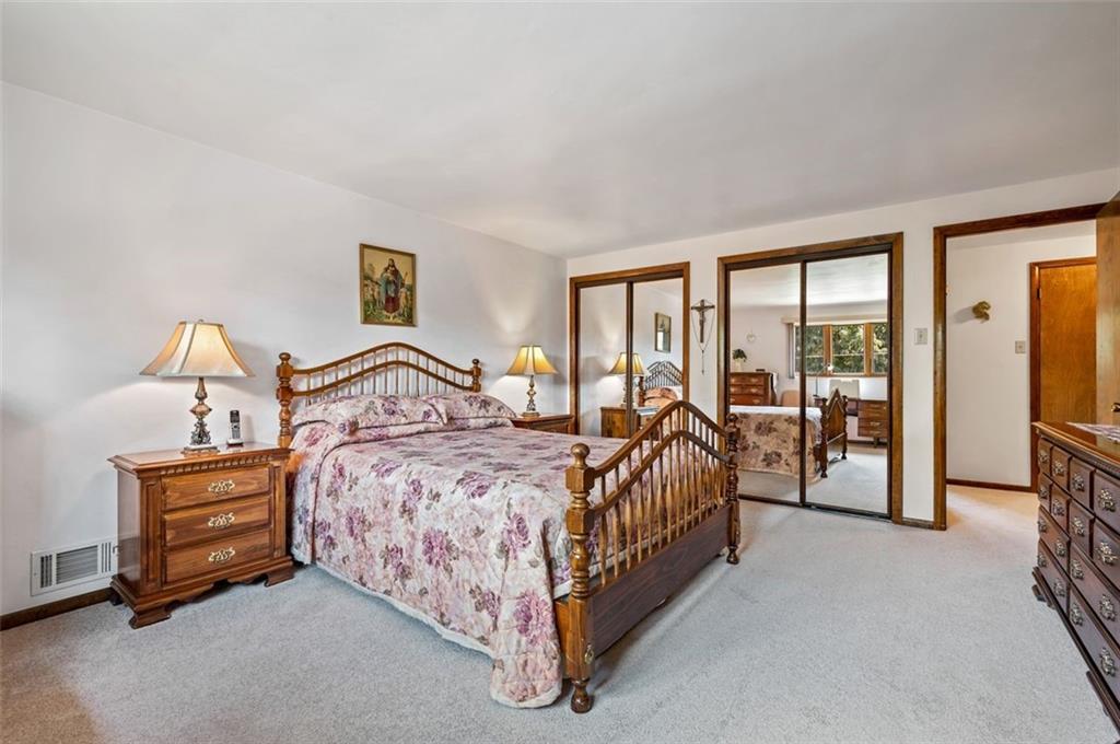 236 Philander Street Pittsburgh, PA 15218 - Photo 21 of 35 a bed sitting in a bedroom next to a window with a tv