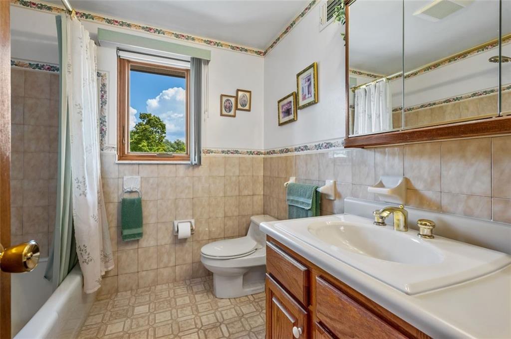 236 Philander Street Pittsburgh, PA 15218 - Photo 25 of 35 a bathroom with a sink toilet and shower