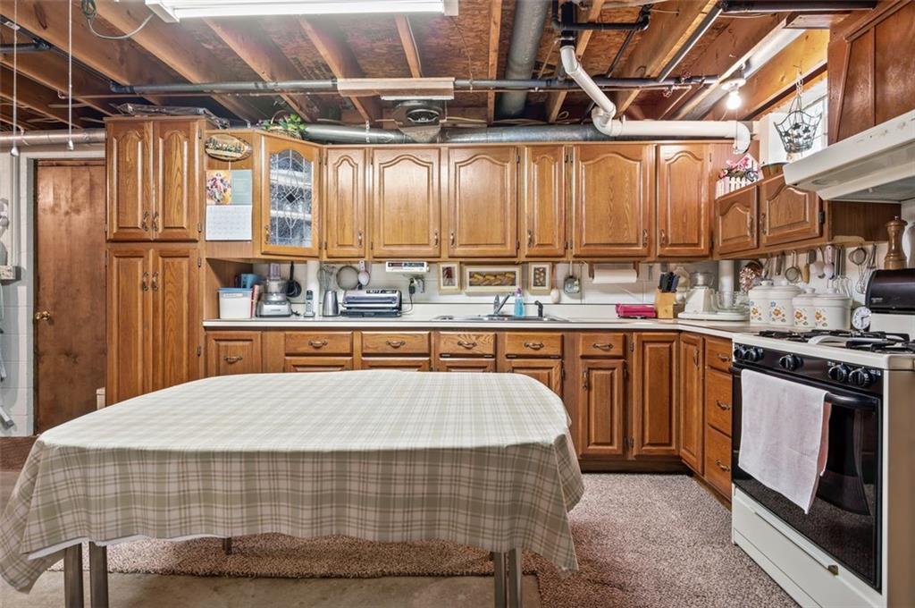 236 Philander Street Pittsburgh, PA 15218 - Photo 28 of 35 a bed sitting in a kitchen next to a window