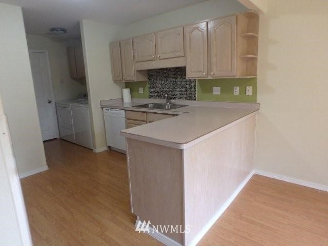 901 North Harding Road Elma, WA 98541 - Photo 15 of 22 a kitchen with a sink and a refrigerator