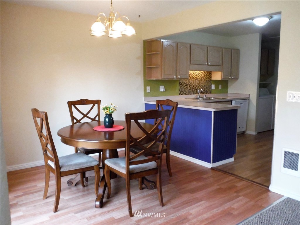 901 North Harding Road Elma, WA 98541 - Photo 4 of 22 a dining room with a wooden table and chairs