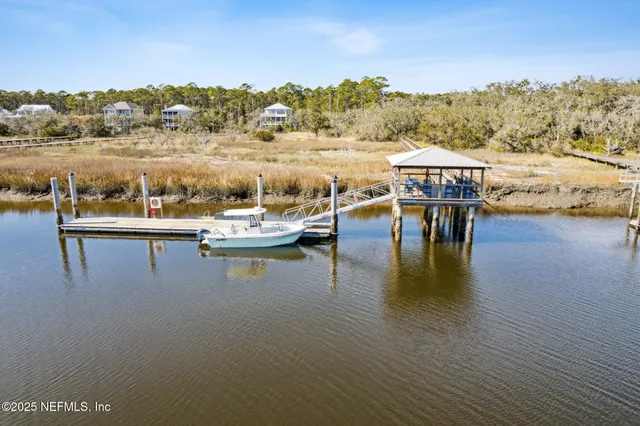 a front view of a house with porch and garden