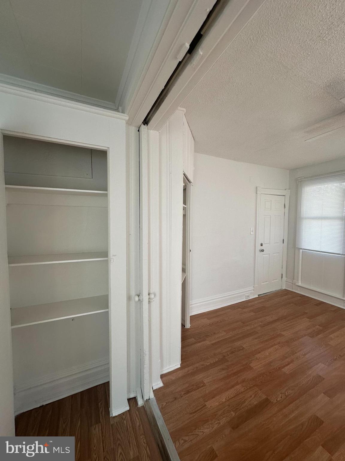 829 Concord Street, Unit A Hagerstown, MD 21740 - Photo 14 of 29 a view of an empty room with wooden floor and a window