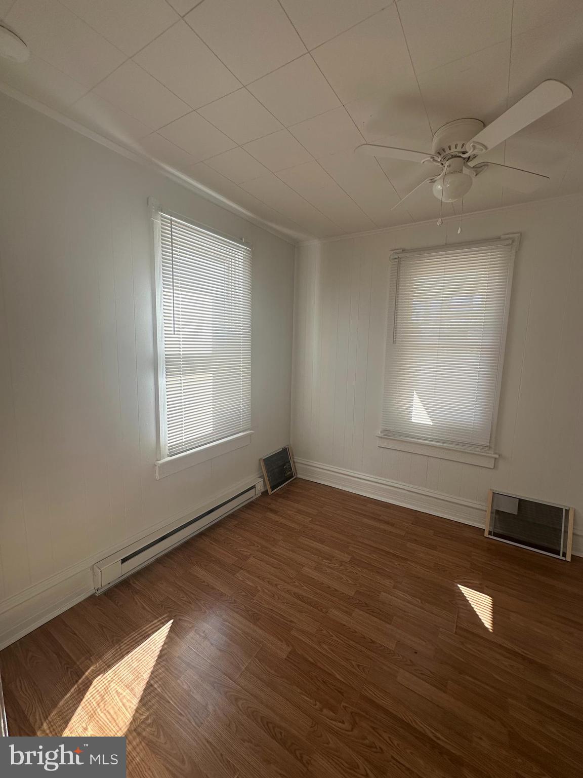 829 Concord Street, Unit A Hagerstown, MD 21740 - Photo 15 of 29 an empty room with wooden floor and windows