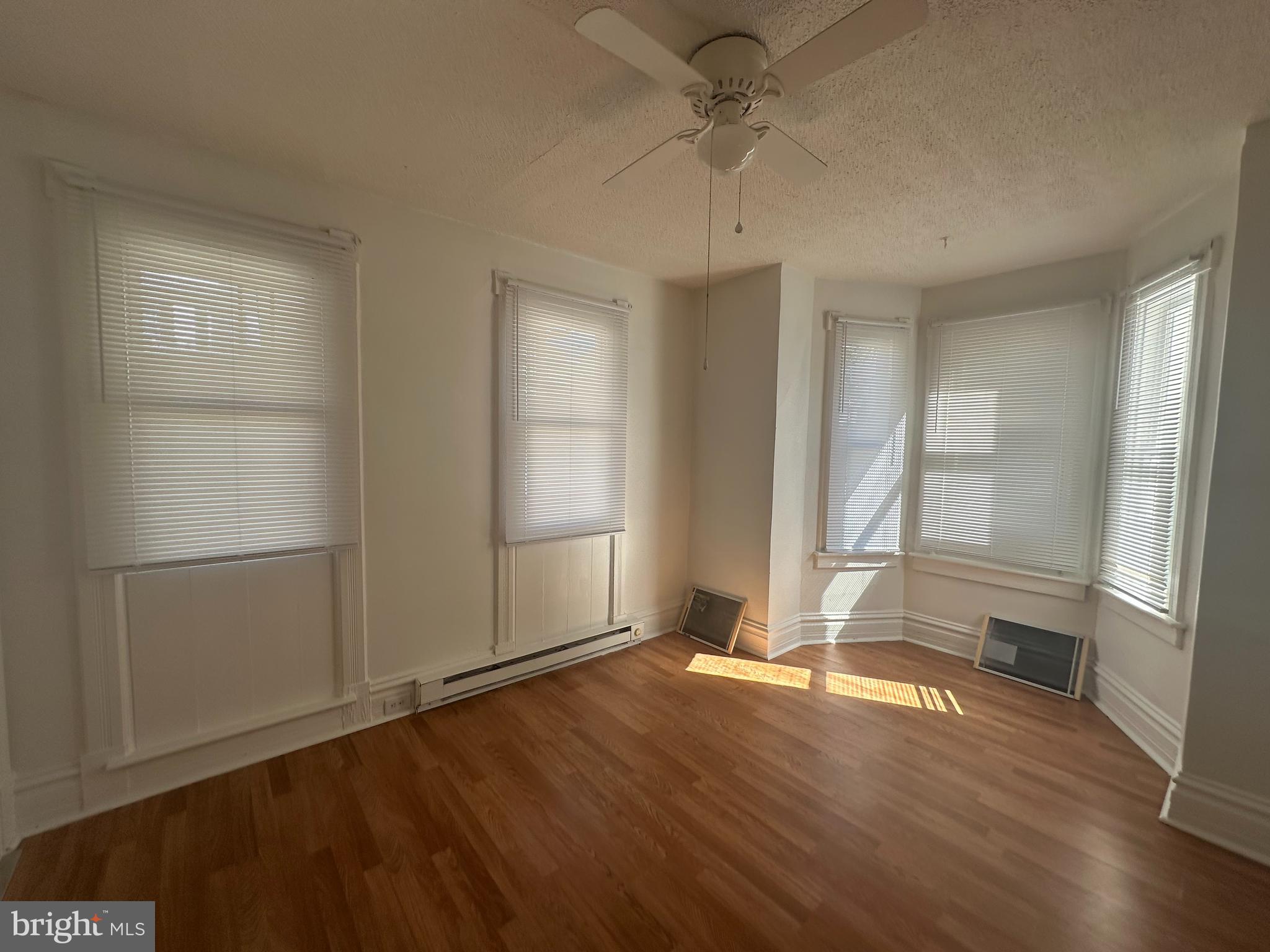 829 Concord Street, Unit A Hagerstown, MD 21740 - Photo 20 of 29 an empty room with wooden floor and windows