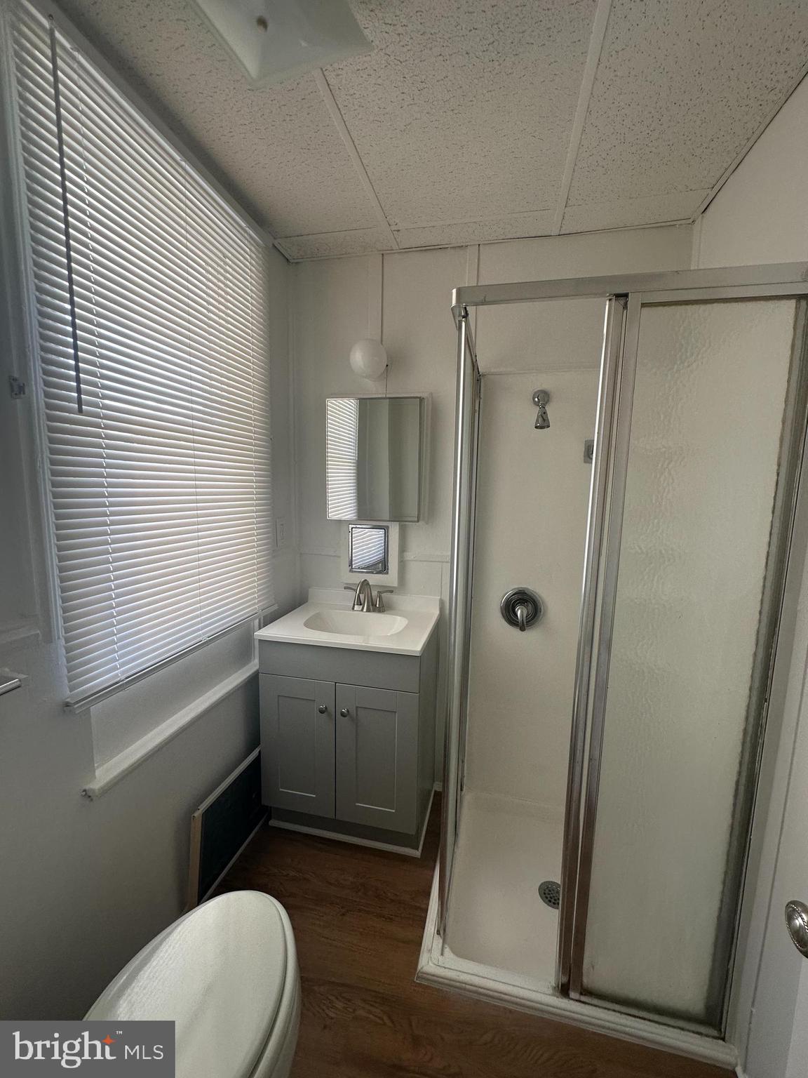 829 Concord Street, Unit A Hagerstown, MD 21740 - Photo 22 of 29 a bathroom with a granite countertop sink toilet and shower