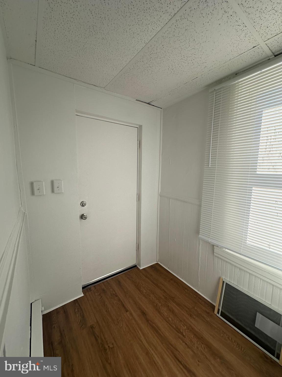 829 Concord Street, Unit A Hagerstown, MD 21740 - Photo 29 of 29 wooden floor in an empty room with a window
