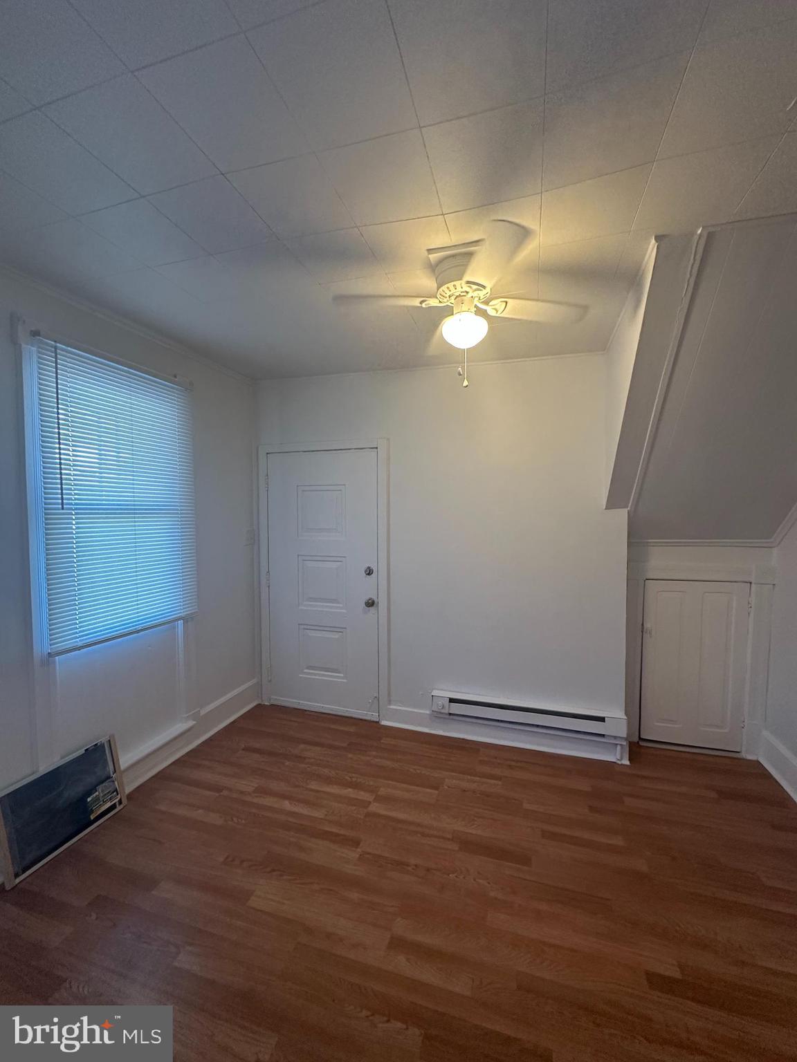 829 Concord Street, Unit A Hagerstown, MD 21740 - Photo 5 of 29 an empty room with wooden floor and windows