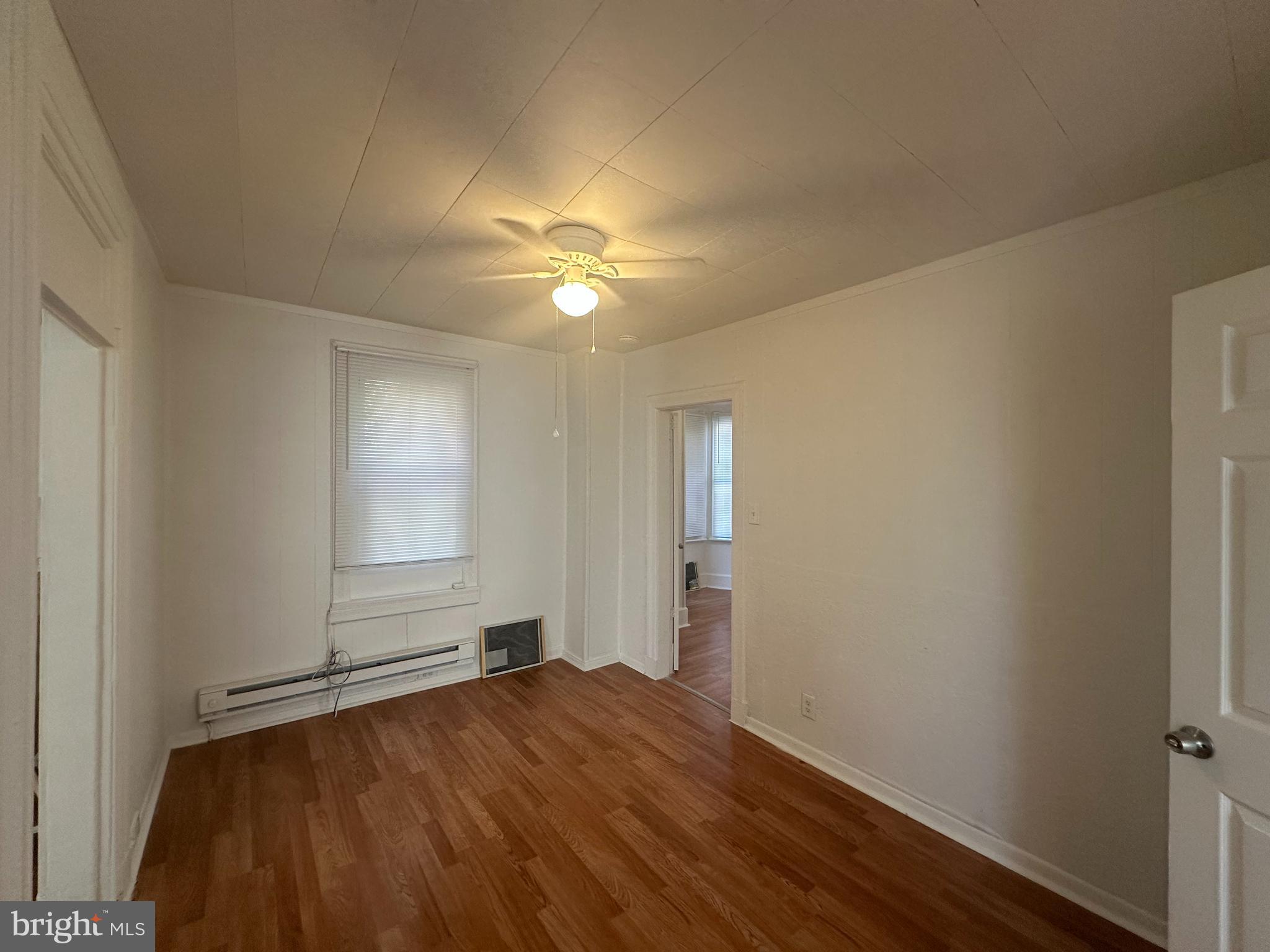 829 Concord Street, Unit A Hagerstown, MD 21740 - Photo 10 of 29 an empty room with wooden floor and windows