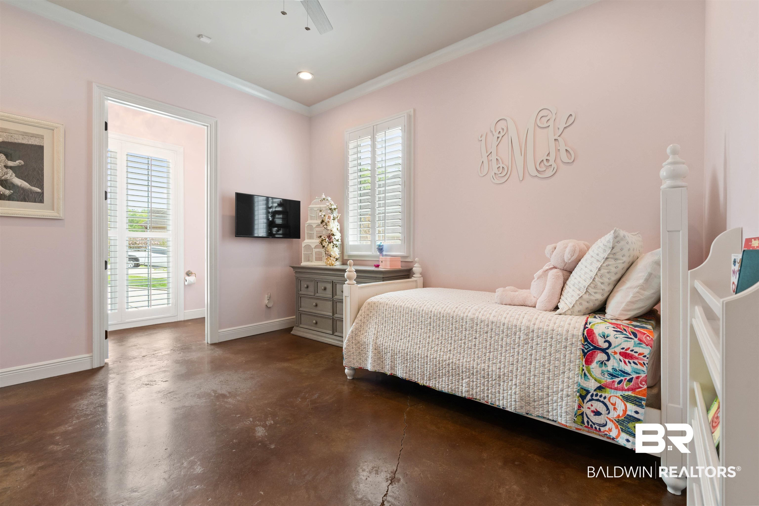 3584 Rue Royal Mobile, AL 36693 - Photo 22 of 35 Bedroom featuring crown molding, multiple windows, baseboards, and concrete floors