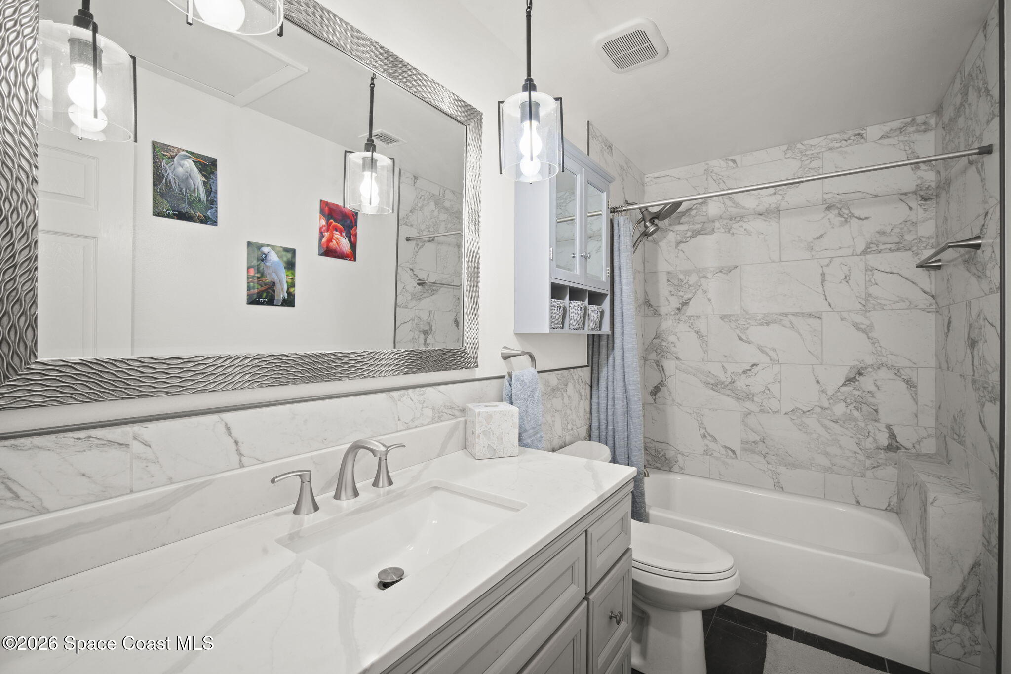 1505 South Carpenter Road Titusville, FL 32796 - Photo 18 of 36 a bathroom with a sink toilet tub and shower