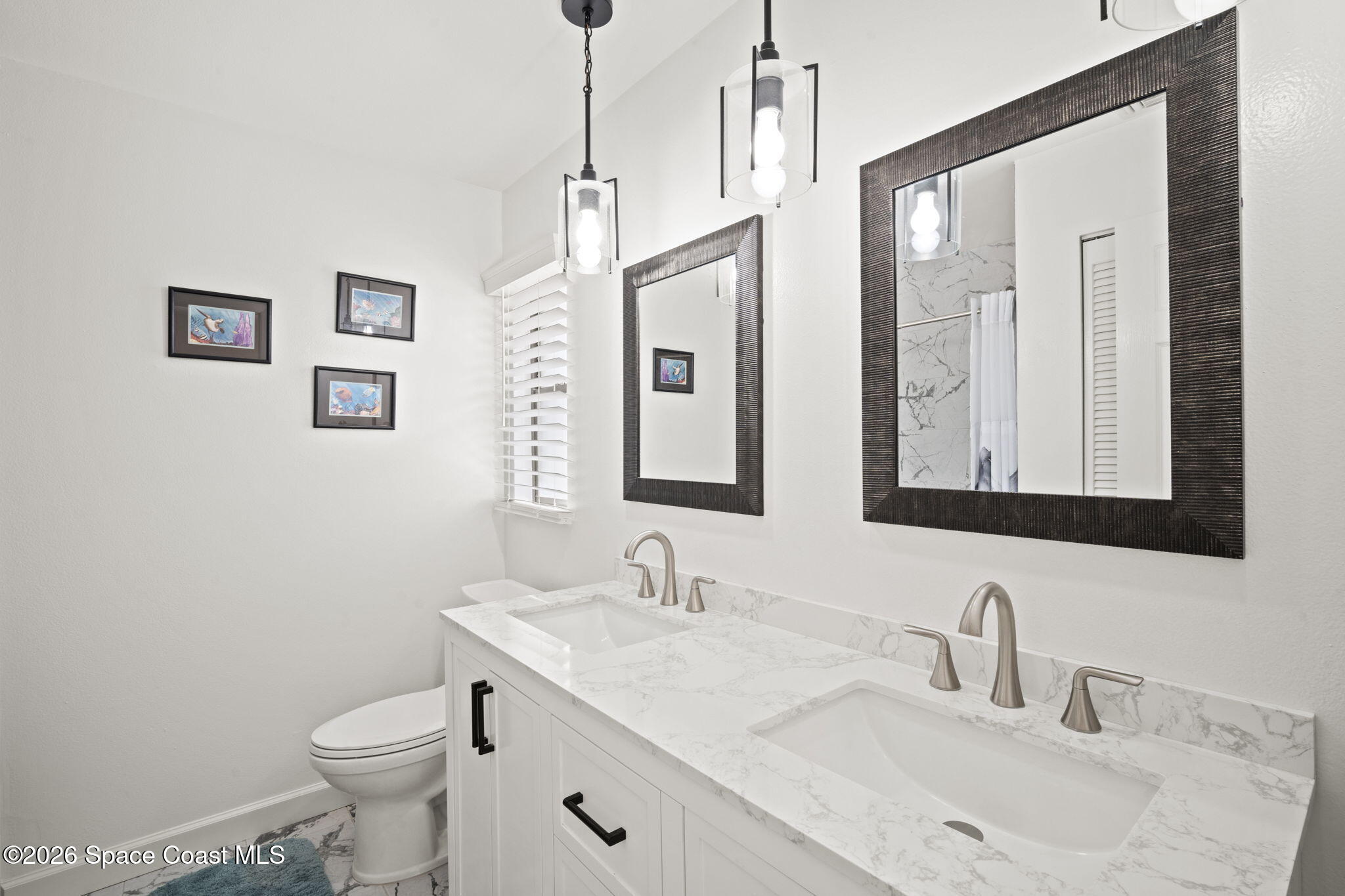 1505 South Carpenter Road Titusville, FL 32796 - Photo 21 of 36 a bathroom with a granite countertop toilet sink and mirror